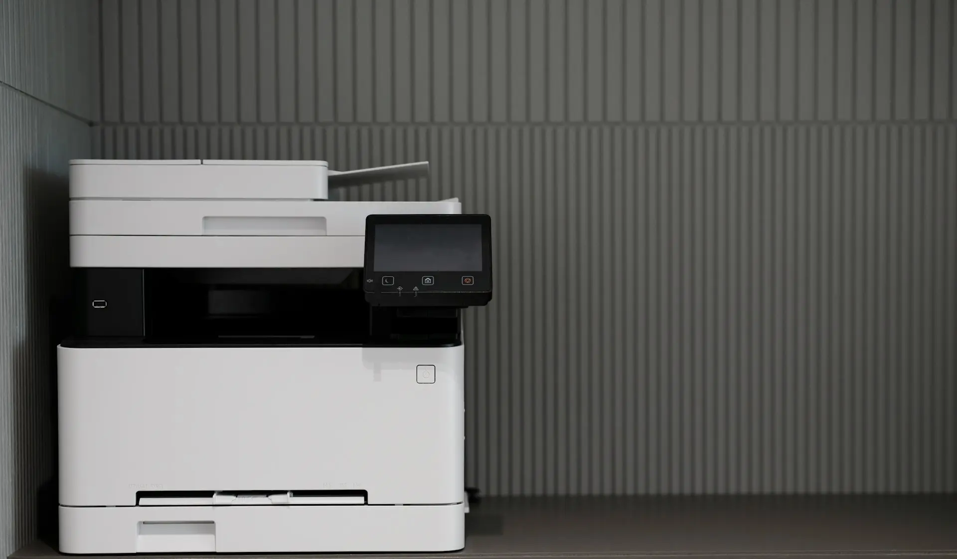 a white and black printer sitting on top of a counter